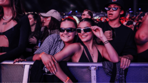 girls striking pose at music festival