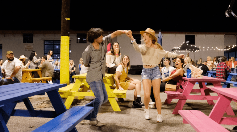 Two people line dancing