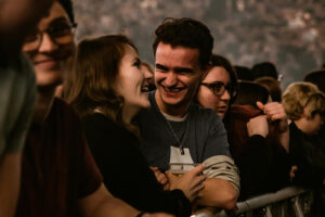 Music fans in the crowd at a concert