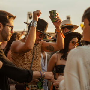 People dance at an outdoor party