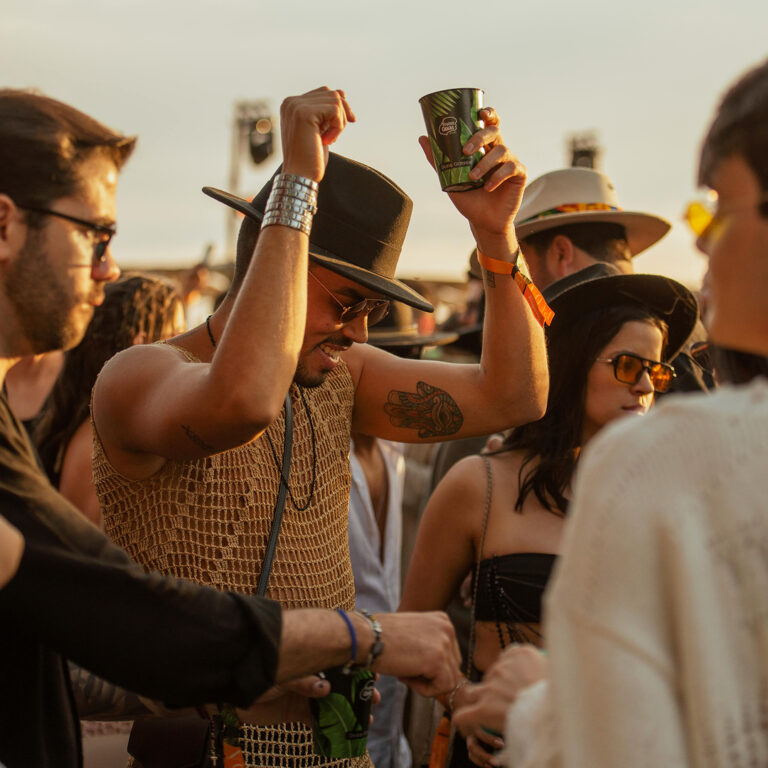 People dance at an outdoor party